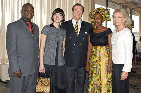 From left, 2007 fellows Benson Amallo (Kenya), Marie Jose Borges (Uruguay), Sir Roger Moore, Agnes Asiimwe (Uganda) and Lady Kristina Moore, 2007 annual luncheon